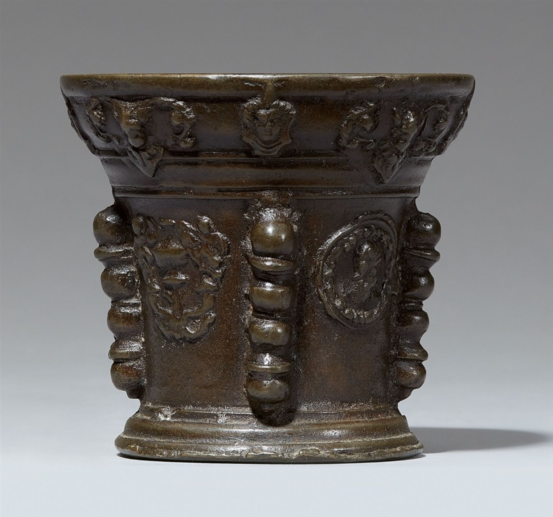 A French ribbed mortar with grotesquesCast bronze with dark brown patina (slightly porous). Of