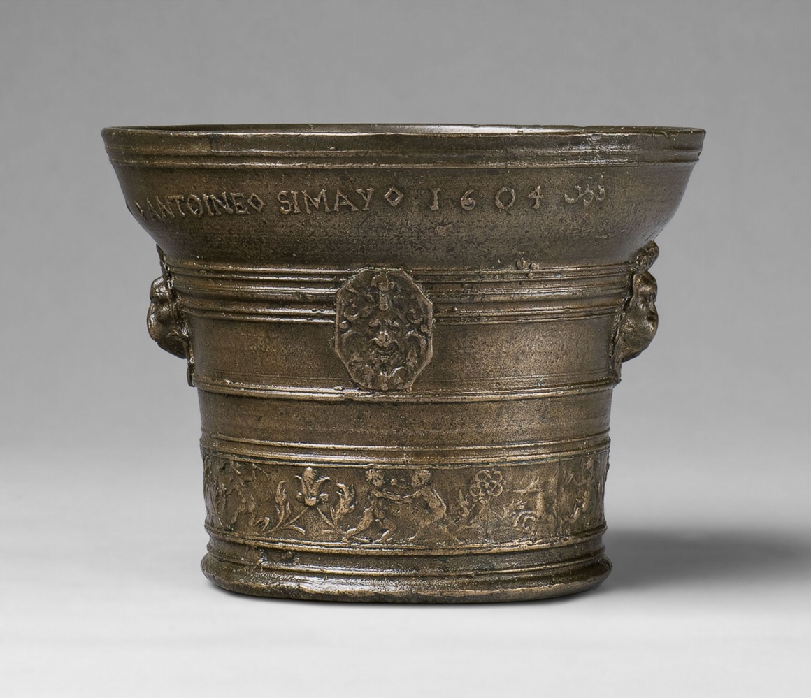 A French mortar dated 1604Cast bronze with golden brown patina. Of tapering form with rounded