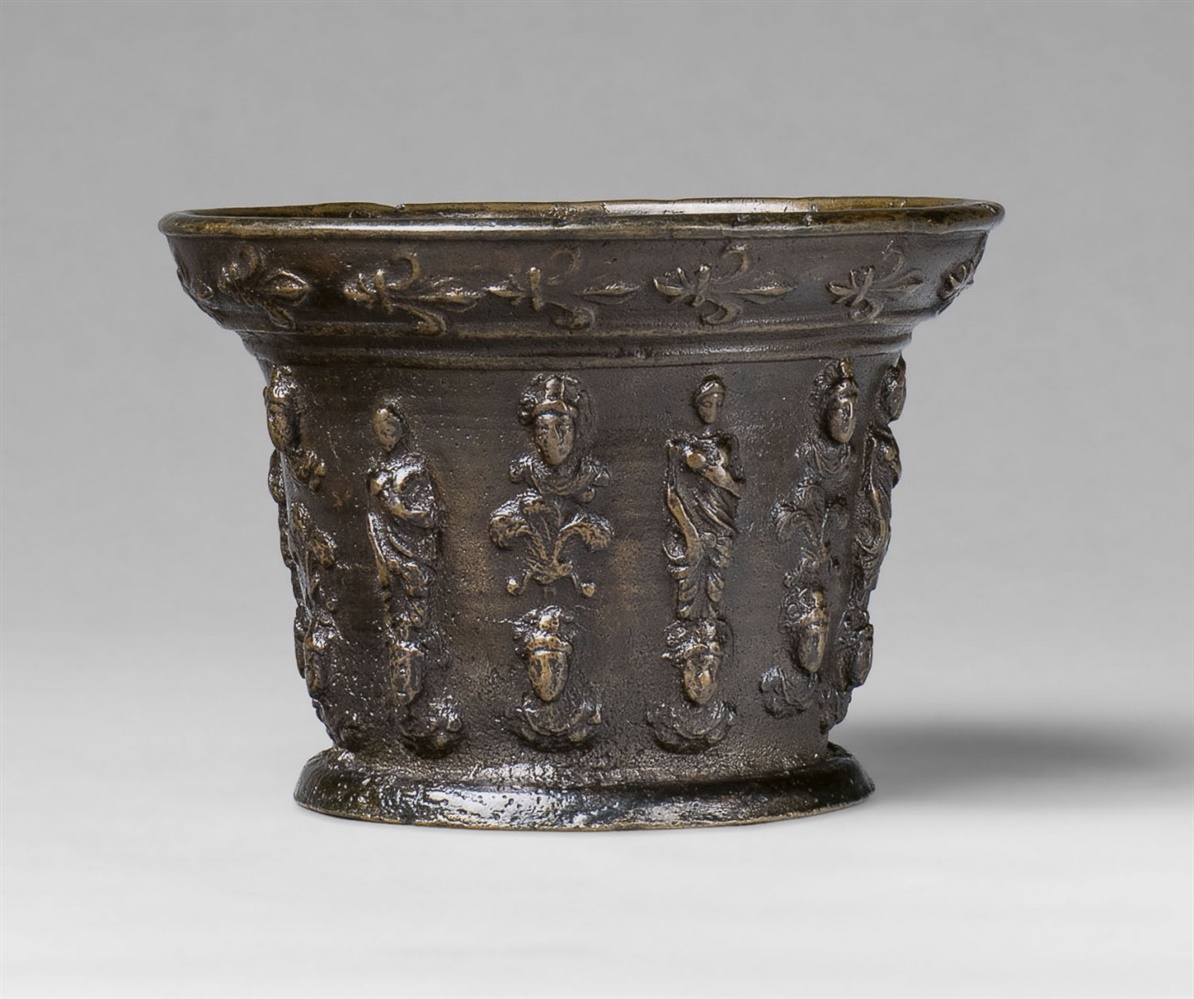 A French mortar with figural pilastersPorous cast bronze with chocolate brown patina. With six