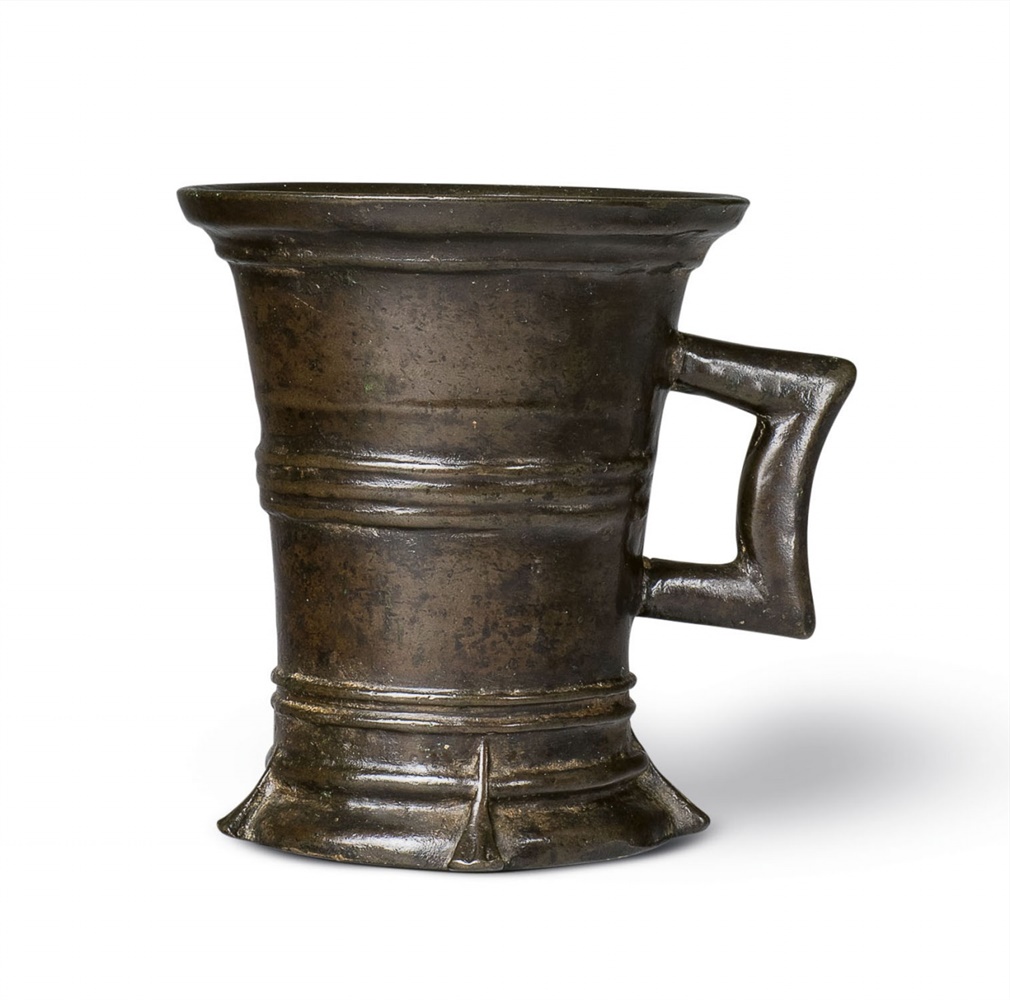 A small Gothic one-handled mortarCast bronze with mottled golden brown patina. Of tapering form,