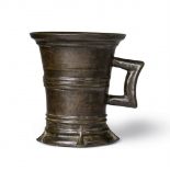 A small Gothic one-handled mortarCast bronze with mottled golden brown patina. Of tapering form,