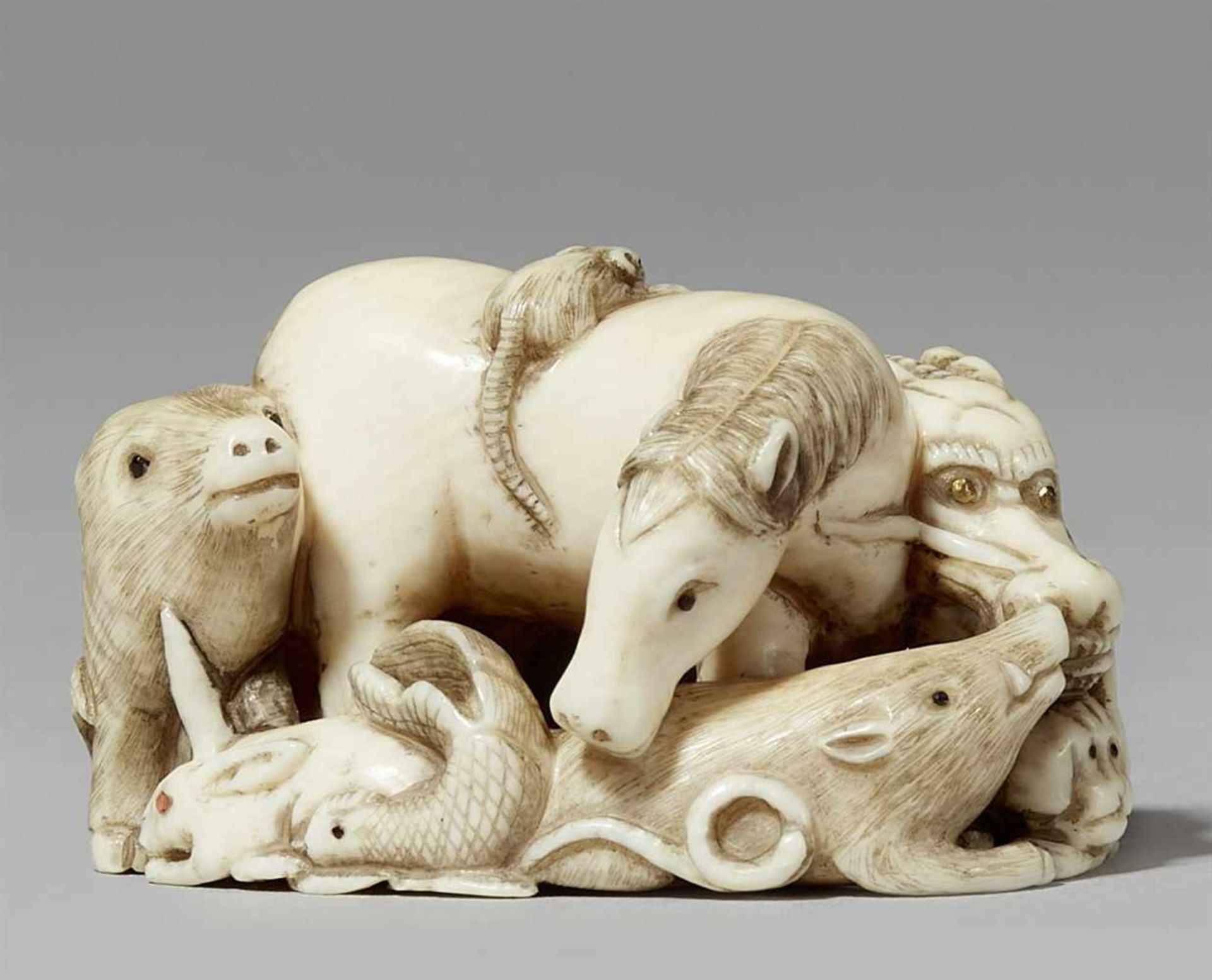 A finely carved ivory netsuke of the jûnishi