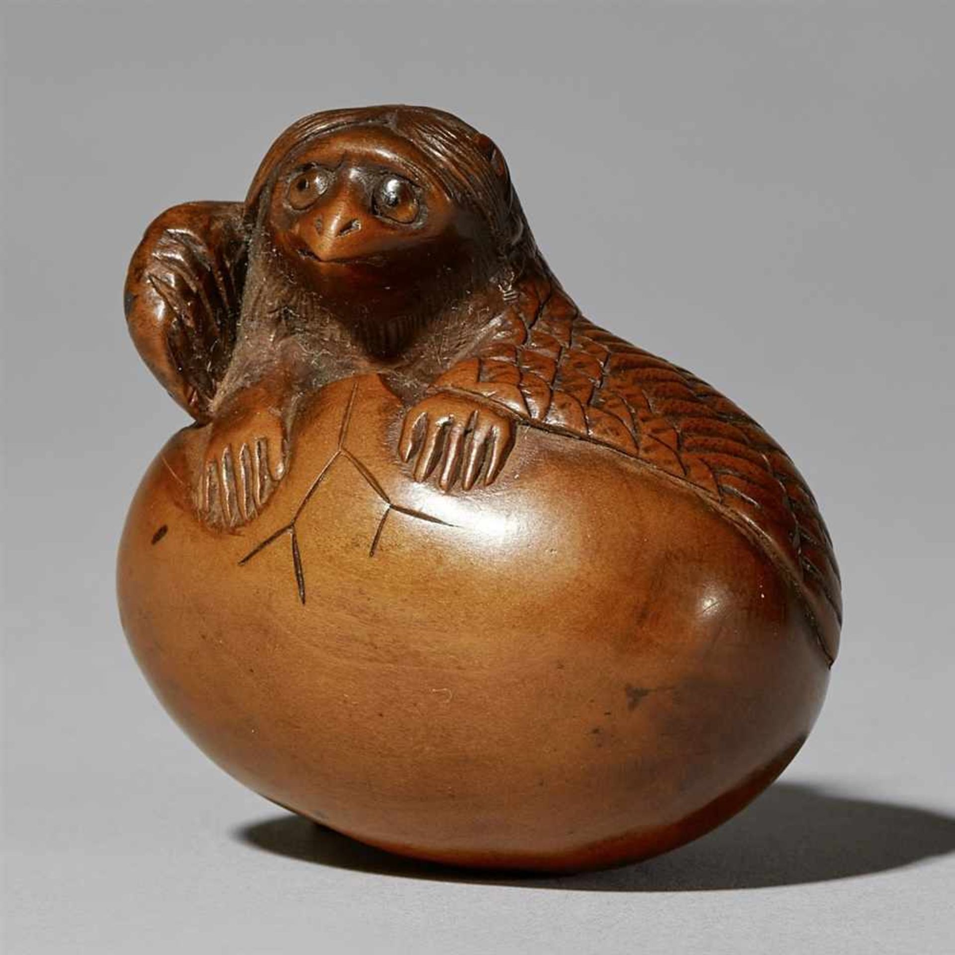 A boxwood netsuke of a tengu no tamago. First half 19th century