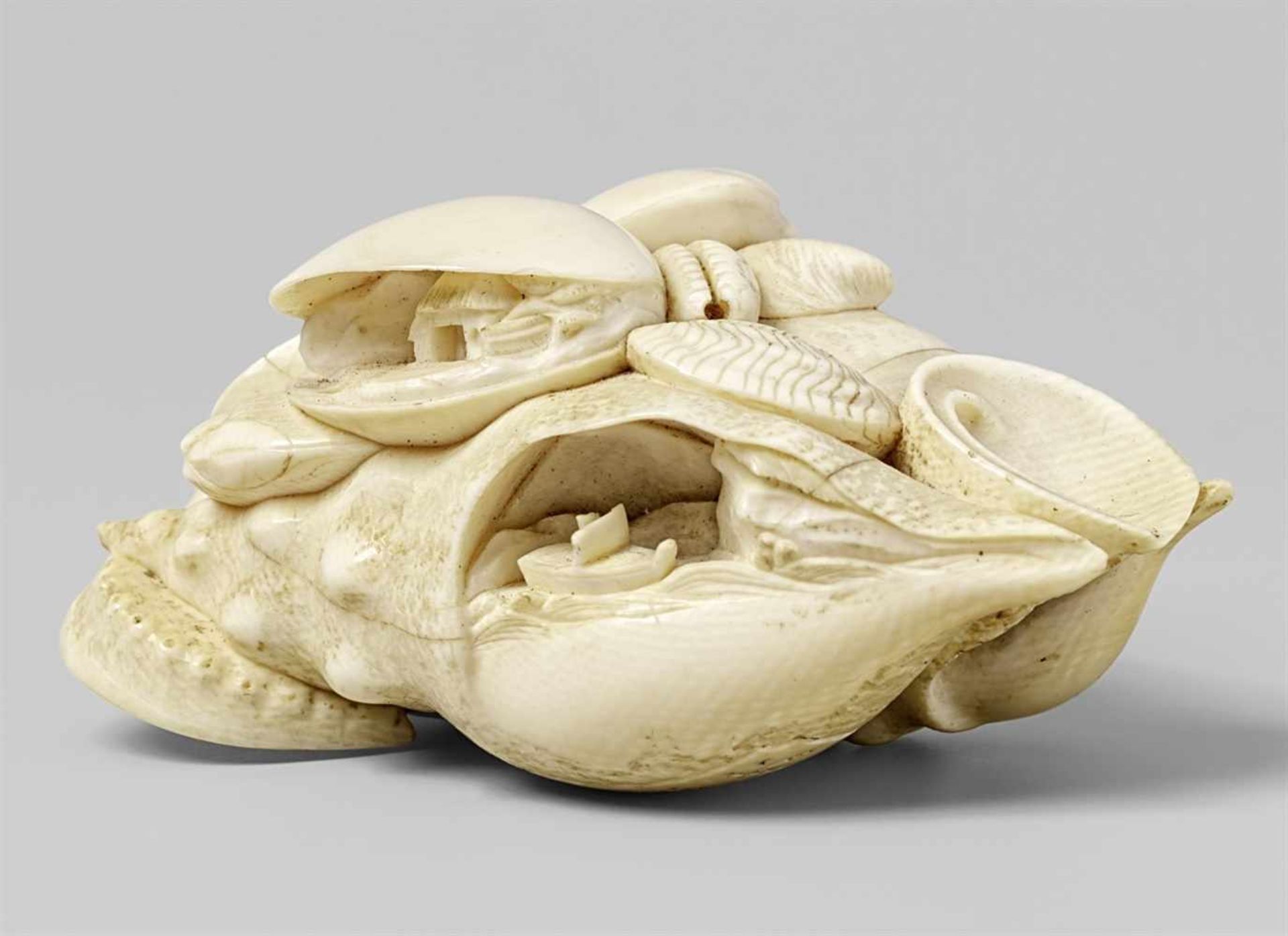A large ivory netsuke of a cluster of clams. 19th century