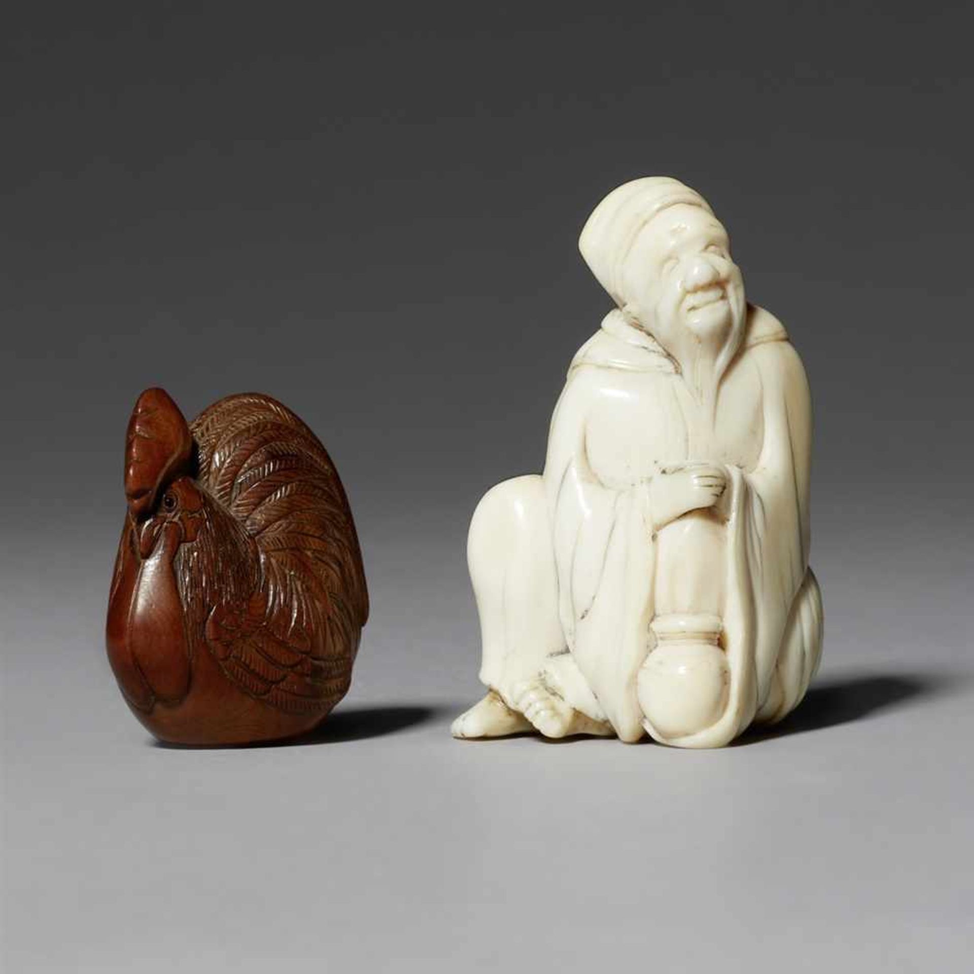 Two Netsuke. Wood and ivory. 19th century