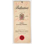 Publicity card for Ballantine’s whiskey, with some notes handwritten in red and green ink: “Feliz 18