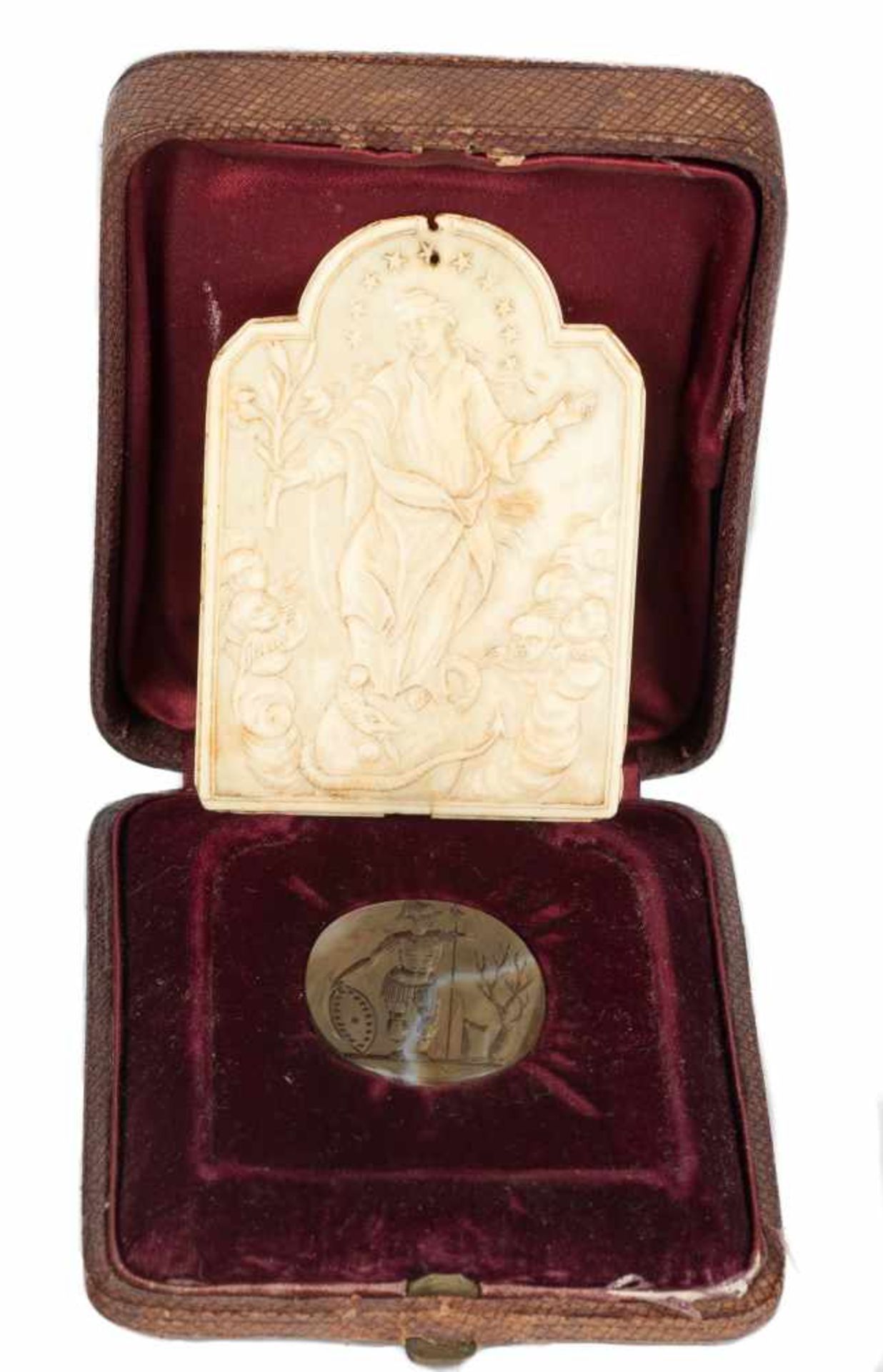 Set including:“Immaculate conception of Mary” Sculpted ivory plaque. European School. Circa 1700 and