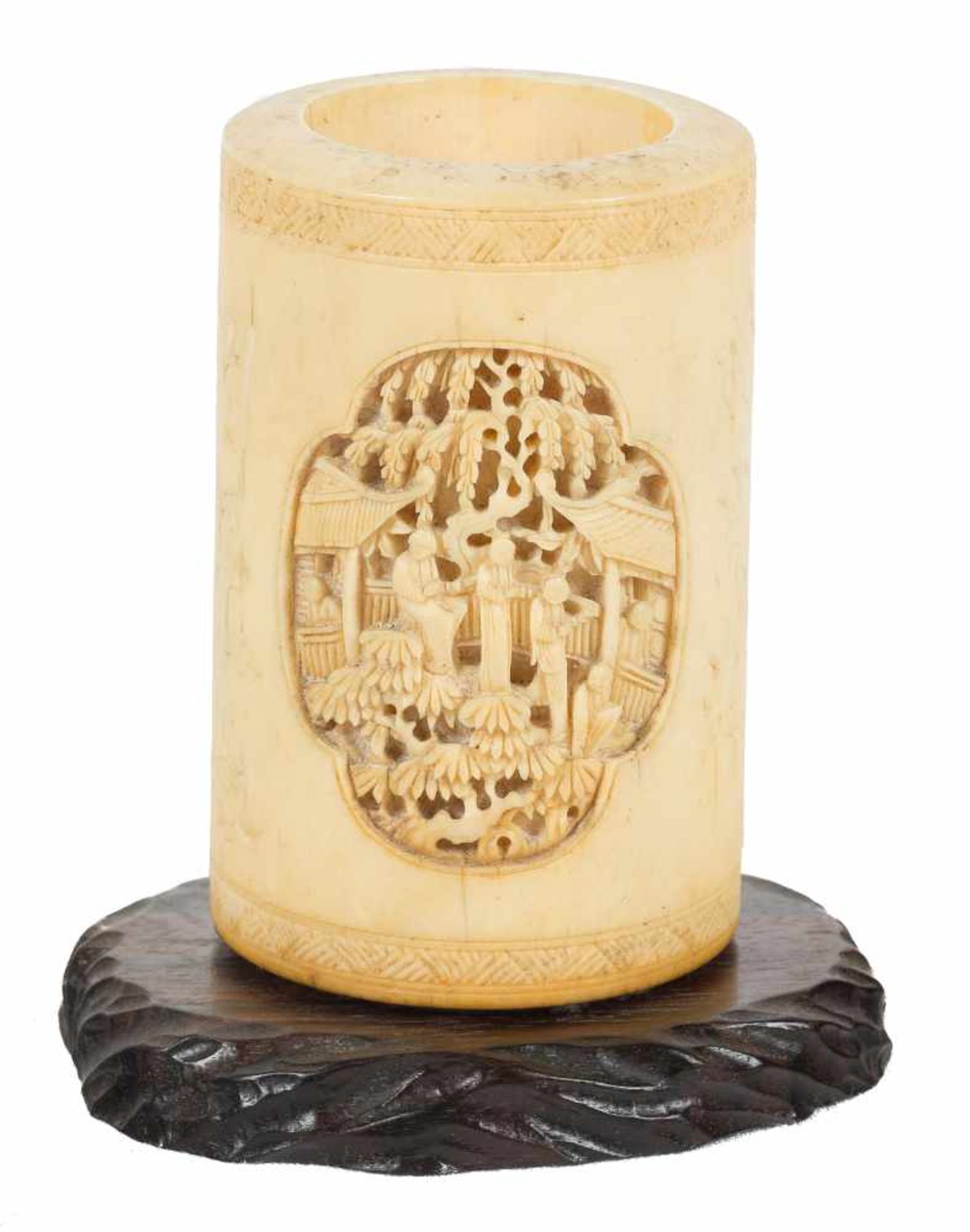 A fine ivory brushpot of cylindrical form. Qing dynasty, 19th century.Deeply carved with schola