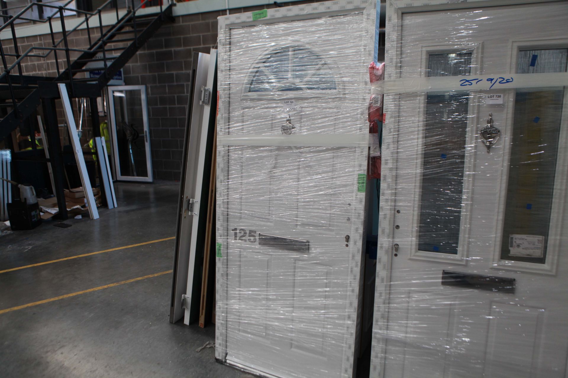 Composite door with arched glazed panel and frame in White