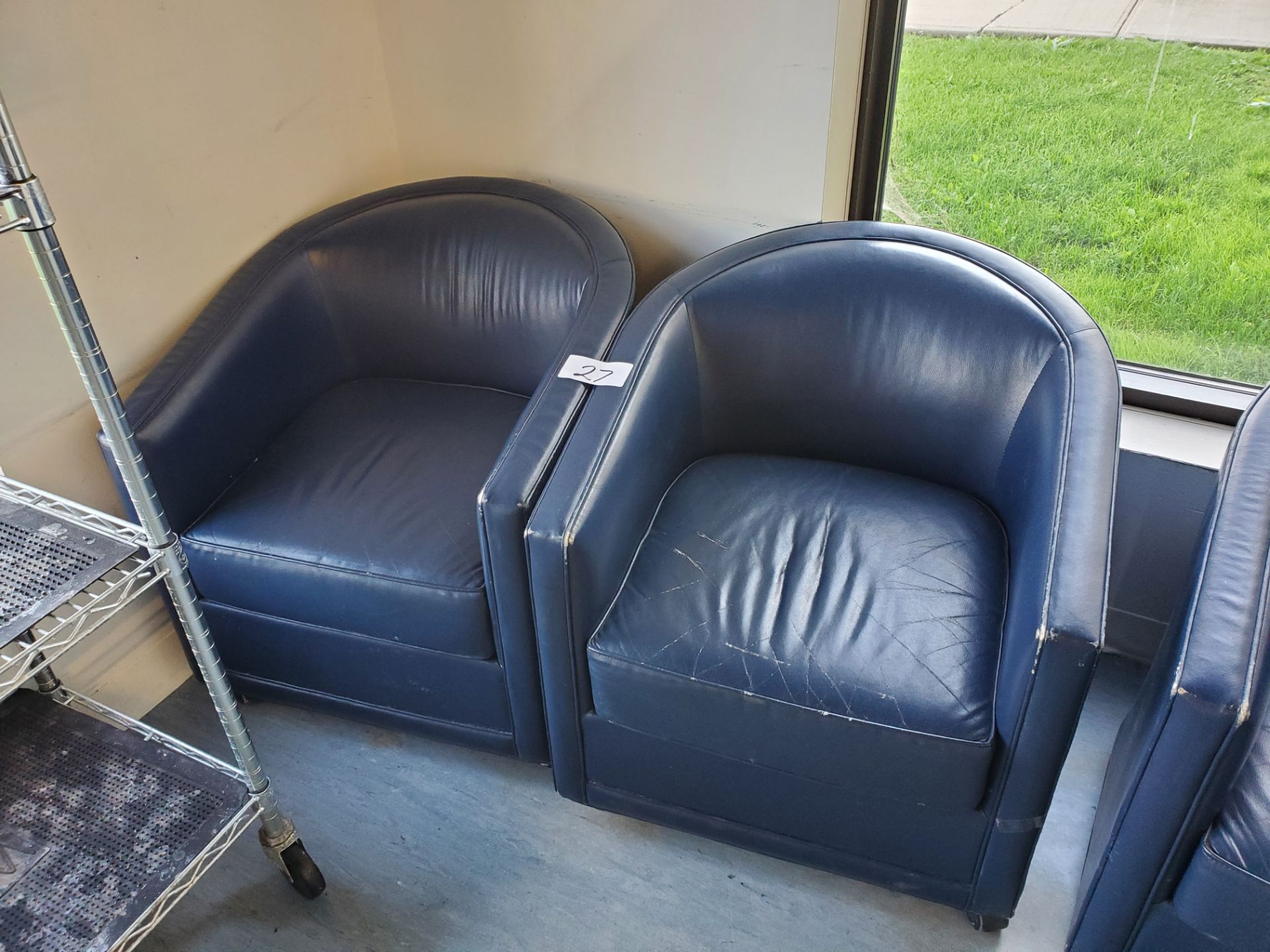 Pair of Blue Faux Leather Rolling Arm Chair