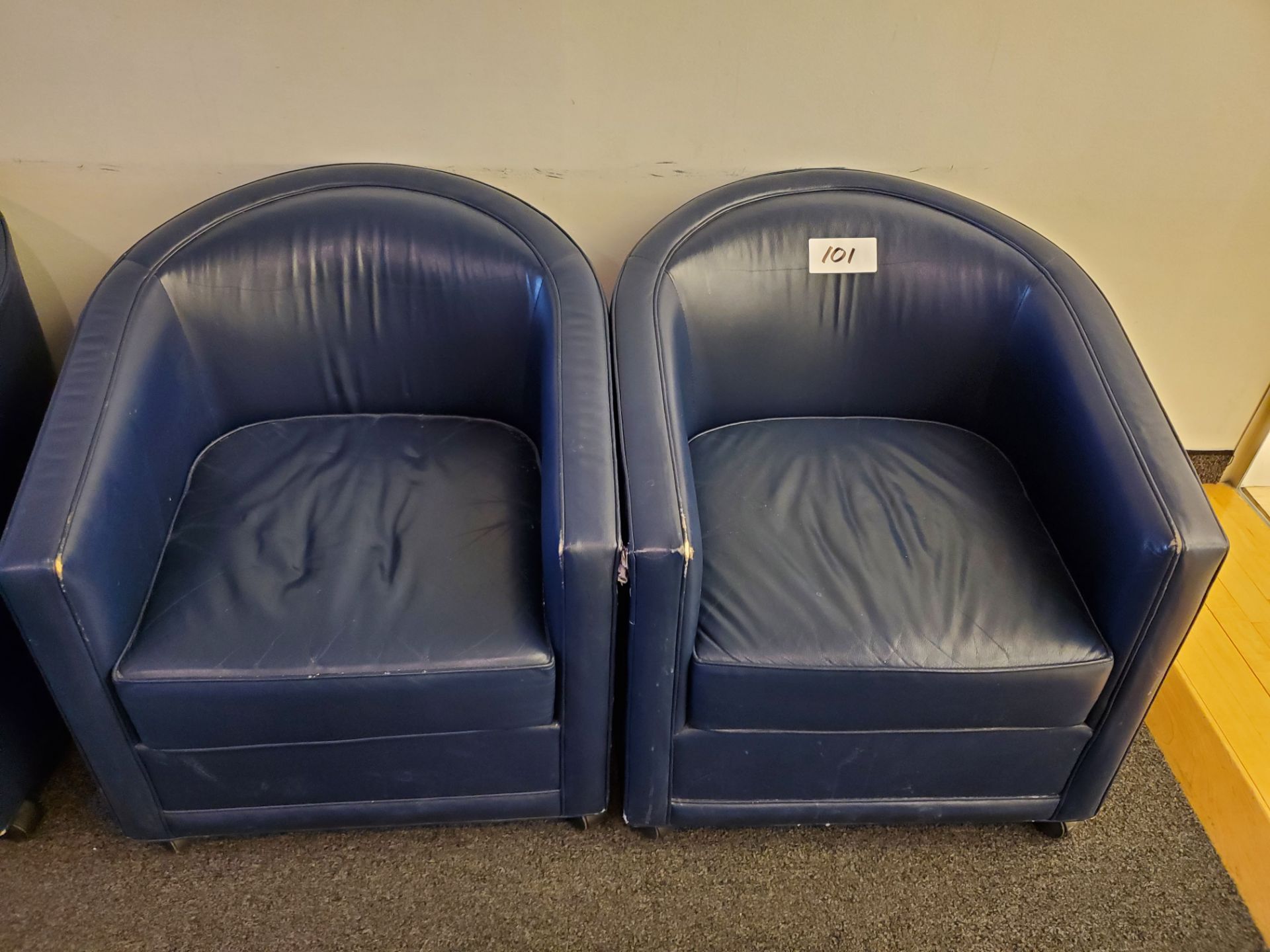 Pair of Blue Faux Leather Rolling Arm Chair