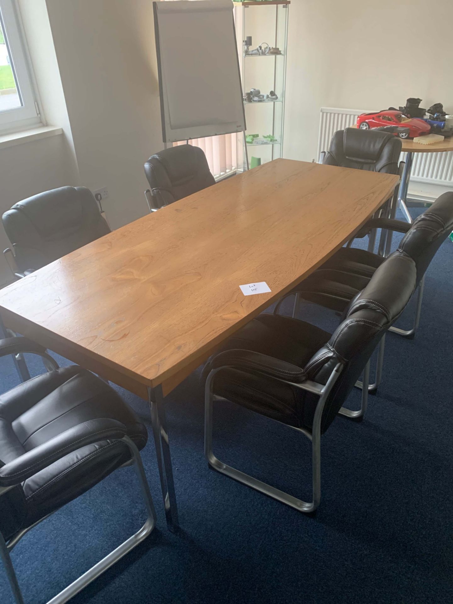 CONTENTS OF BOARDROOM to include boardroom table, 6 leather chairs, 4 glass cabinets and flip chart