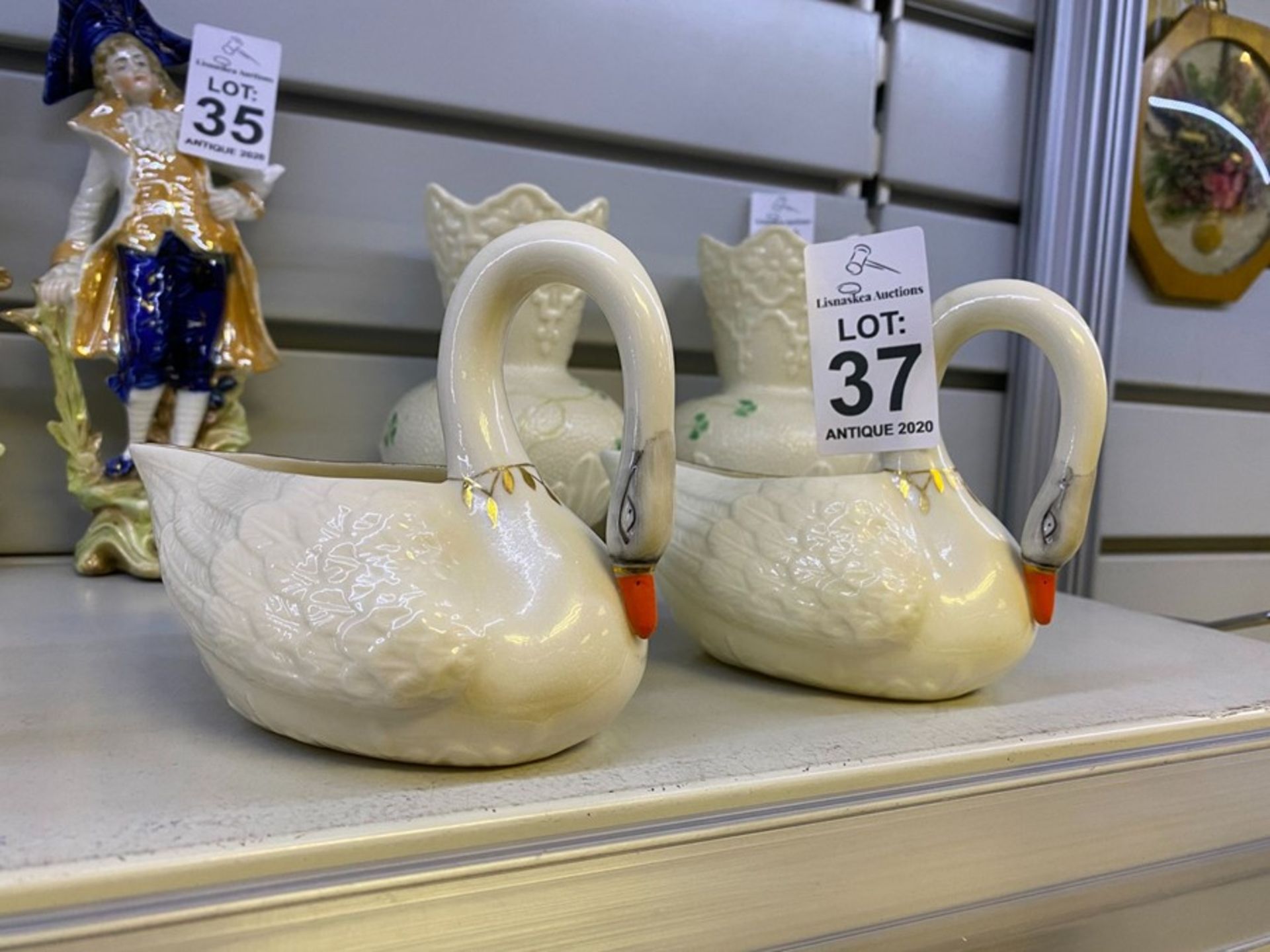 PAIR OF BELLEEK BROWN STAMP SWANS