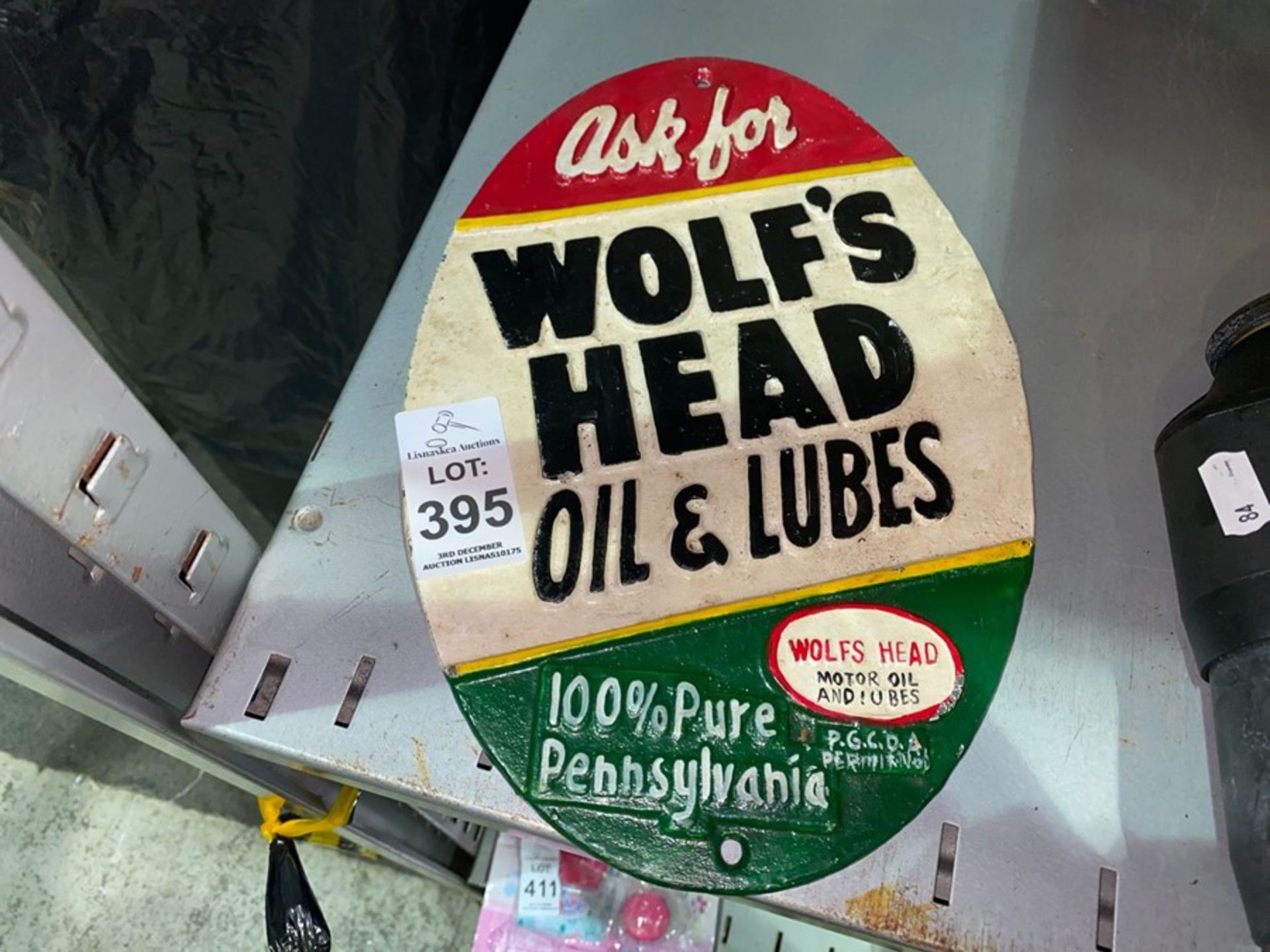 CAST IRON WOLF'S HEAD OIL & LUBES SIGN