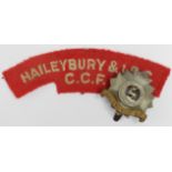 Badges (2) original Haileybury O.T.C., brass & white metal hat badge + a cloth title for