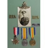 1915 Star Trio to 76799 Gnr W Bentley RFA. With badges and photo postcard. (3)