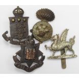 Badges (4) original Hat badges comprising 1st. Batt. Monmouthshire Regt., R.W.F., East Surrey Regt.,
