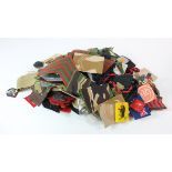 Assorted British Militaria in a box. Cloth Formation signs, shoulder titles, arm badges, Rank