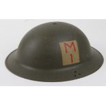 WW2 Home Guard helmet on one side is a (div patch M over 1 in a cream box) stamped on the rim J.S.S.