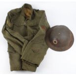 WW1 US soldiers service jacket complete with WW1 US army insignia and US Army Brodie helmet with div