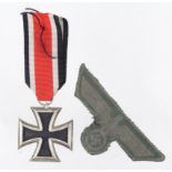German WW2 Iron Cross 2nd Class, and a cloth eagle and swastika. (2)