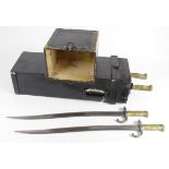 Bayonets: A truly unique carrying box containing 3x good Chasspot Model 1866 Sabre Bayonets in their