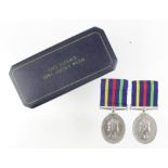 Civil Defence LS Medal Northern Ireland reverse, and British reverse, plus one case. (2)