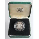 One Pound 1983 silver Proof Piedfort. FDC in the green box of issue (box with spots of mildrew)