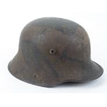 German WW1 1916 pattern Camo helmet. Nice original example with most of its original Camo paint.
