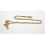 Yellow metal (tests as 18ct and stamped 750) necklace with small crucifix attached, length approx