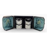 Boxed set of four Elkington silver plated napkin rings - both the rings and the box are lovely