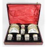 Aynsley. Silver mounted six piece coffee cup set, with floral decoration, hallmarked 'D&H,