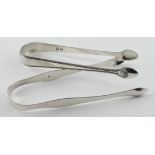 Two pairs of Georgian silver sugar tongs - the pain one is hallmarked Peter & Ann Bateman, London,