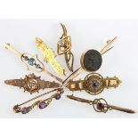 Collection of eight yellow metal / gold brooches some with semi-precious stones, total weight 23.7g