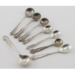 Eight silver salt spoons with decorated handles, all British hallmarks. Weight 1.5oz approx.