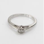 9ct white gold solitaire ring set with 0.10ct diamond, finger size N weight 2.8g