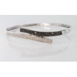 9ct White Gold Bangle set with Black and White Diamonds weight 8.9g