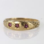 9ct hallmarked Gypsy style Ring set with three Rubies size O weight 1.9g