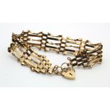 Hallmarked 9ct gold five bar gate bracelet with safety chain, weight 9.2g