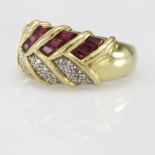 Yellow metal marked 18ct .750 Ring set with Rubies and Diamonds size M weight 6.9g