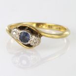 Yellow metal stamped 18ct / Plat three stone diamond and saphire ring, size T, weight 3.5g