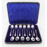 Boxed set of twelve silver teaspoons hallmarked "M.H. & Co. Ltd., Sheffield, 1917". Weight of silver