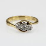 18ct Gold and Platinum three stone Diamond crossover Ring, finger size L weight 3.3g