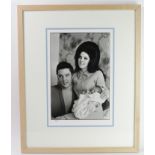 Elvis Presley & Priscilla Presley, 10 x 16" photograph, holding a very young Lisa Marie, taken