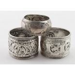 Two early Victorian silver napkin rings both hallmarked London, 1861 (one shows signs of the zodiac)