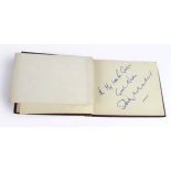 Stanley Matthews. An autograph album containing two Stanley Matthews signatures, along with a few