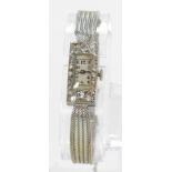 Ladies Art-Deco style cocktail watch. The rectangular white metal case (tests as platinum) the white