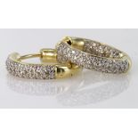 Yellow metal marked .750 18ct Earrings pave set with Diamonds weight 11.2g