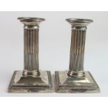 Silver pair of Corinthian column candlesticks, hallmarked 'T.B, London 1903' (Thomas Bradbury &