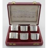 Boxed set of six silver napkin rings with different assay marks for R&B, London, Birm. Sheffield,